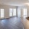 a living room with wood floors and a fireplace